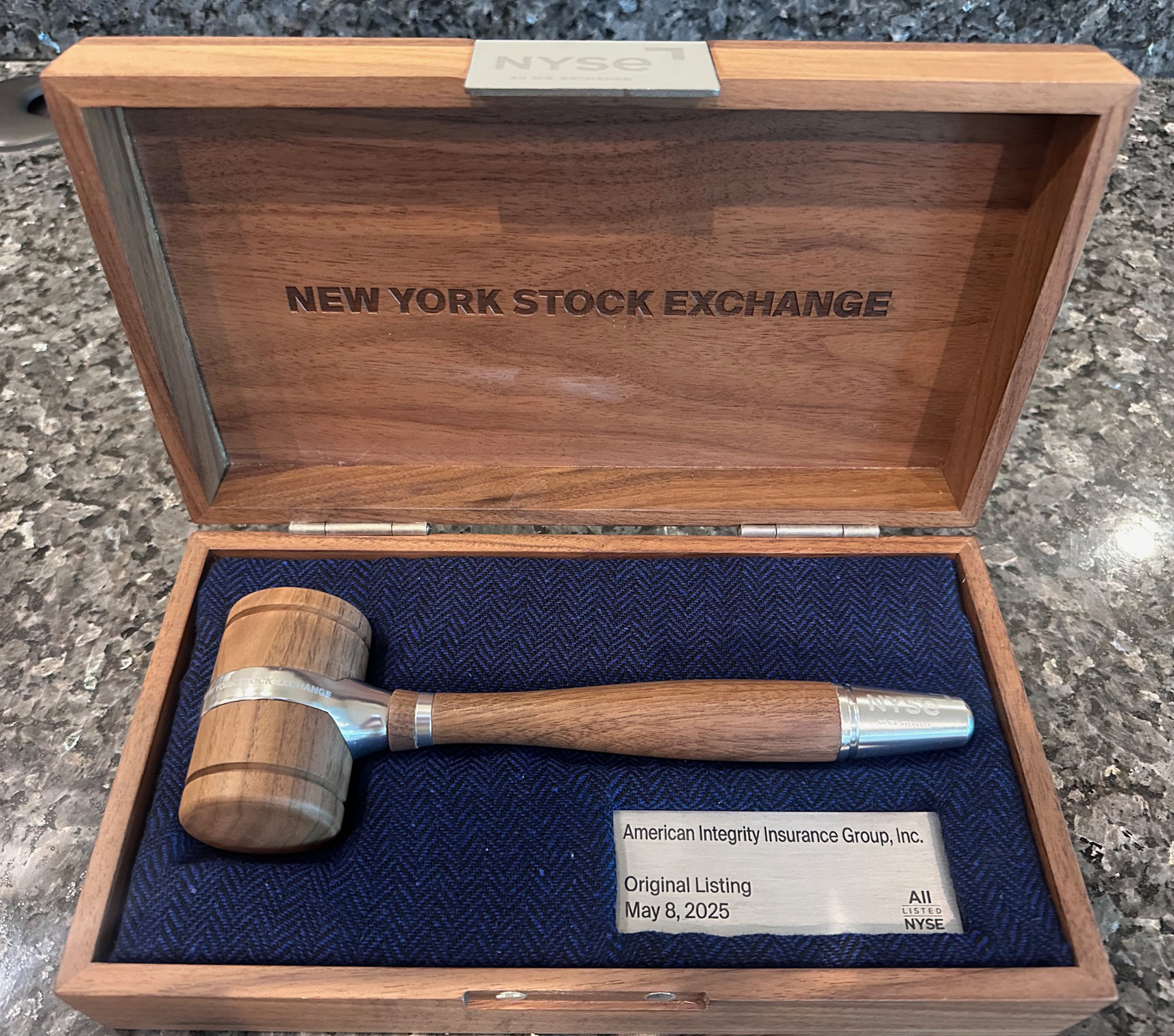 A photo of the gavel used to ring the bell at the New York Stock Exchange for American Integrity's IPO in 2025