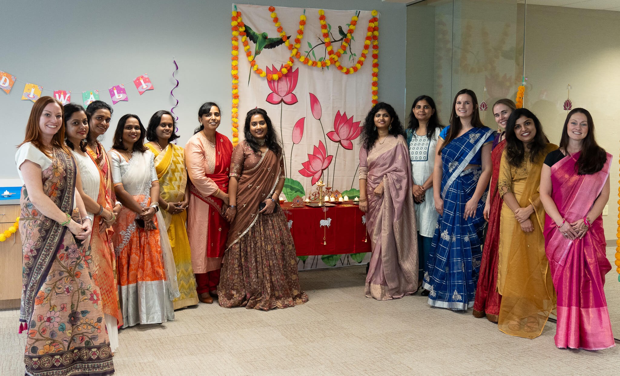 Our IT team dressed in traditional garb at our Diwali Festival of Lights celebration