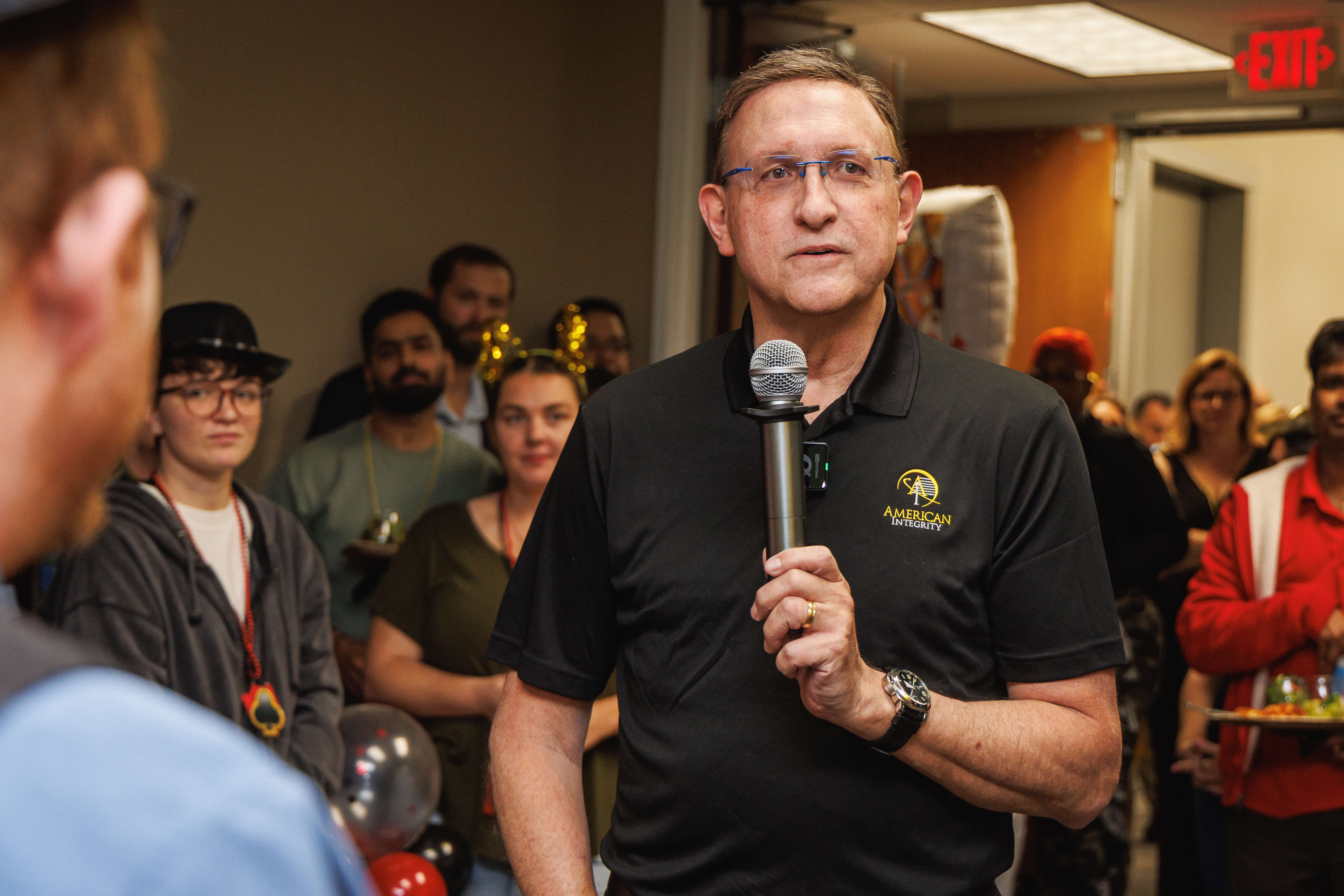 Bob Ritchie gives a speech to celebrate American Integrity's growth