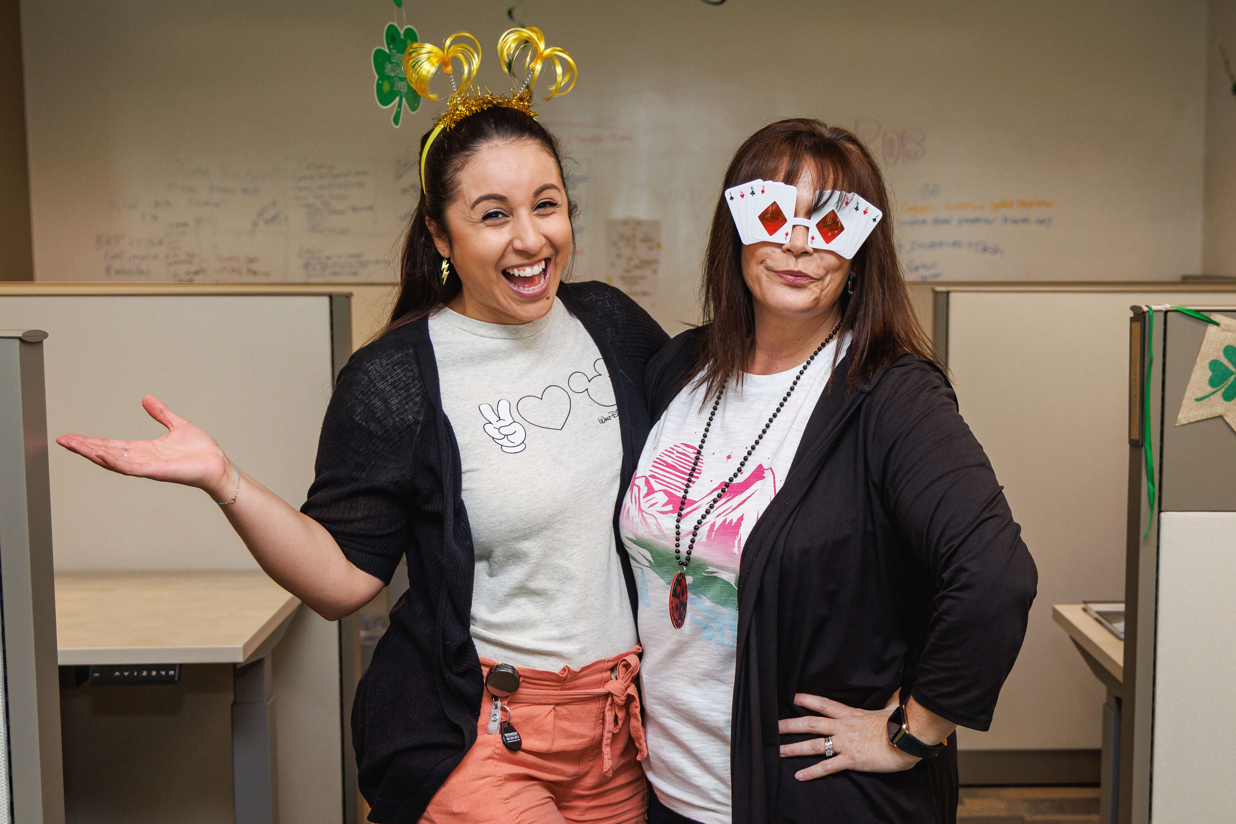 Members of the American Integrity team pose for a photo in silly accessories at the Winning Streaks party