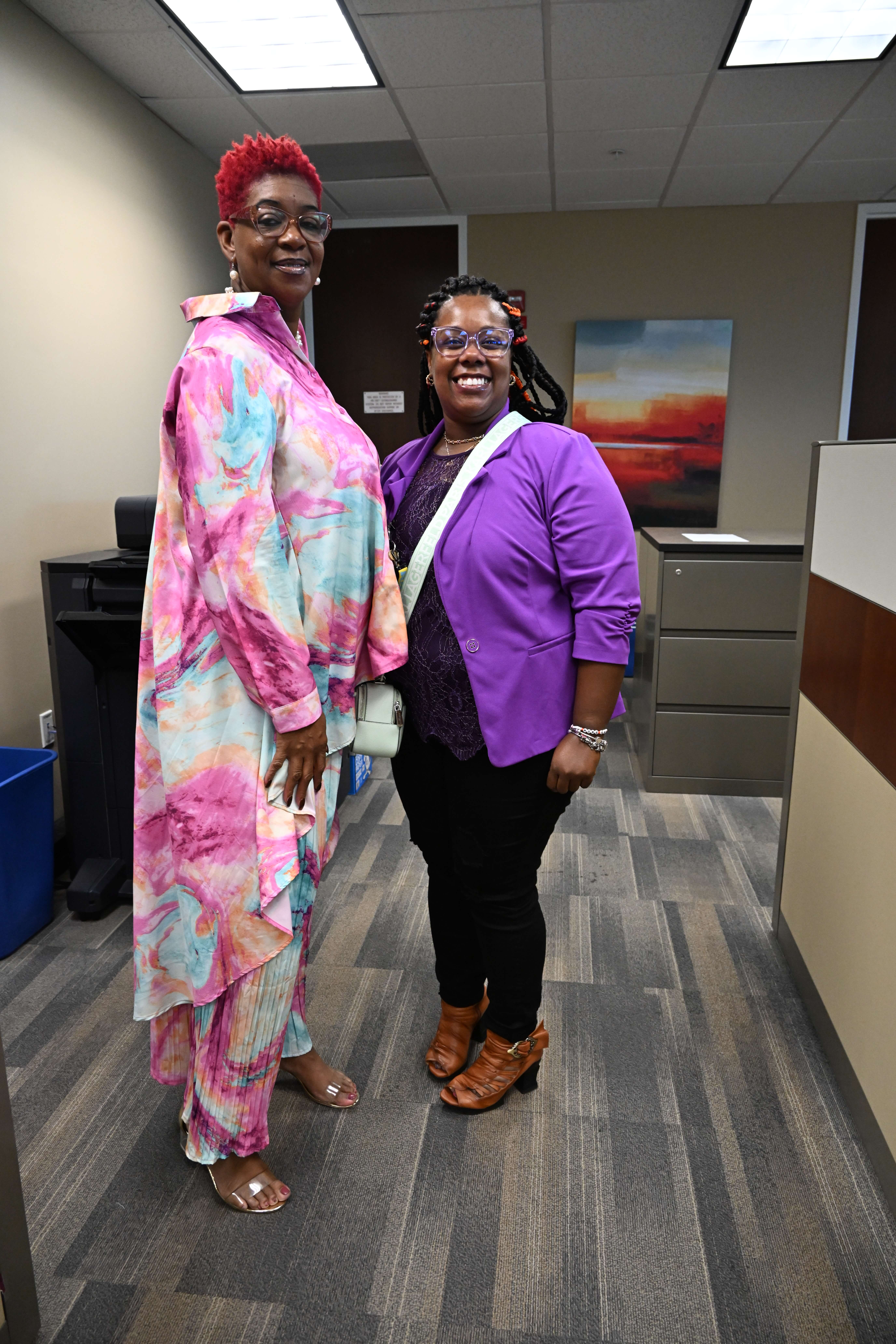 Two members of the Billing Team pose for a photo